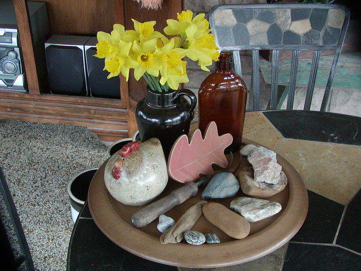 my three seasons porch decorated with mostly finds and vintage, outdoor living, repurposing upcycling, I found this 1 00 lazy susan at a church bizarre and here I showcase some of my favorite beach stones and trinkets