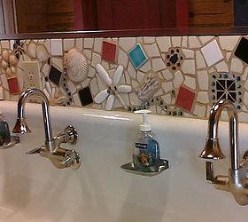 this is a backsplash i created from found things and tiles and glass, home decor, tiling, This backsplash was built for a customer that handed me a box of sentimental trinkets and asked what I could do with them