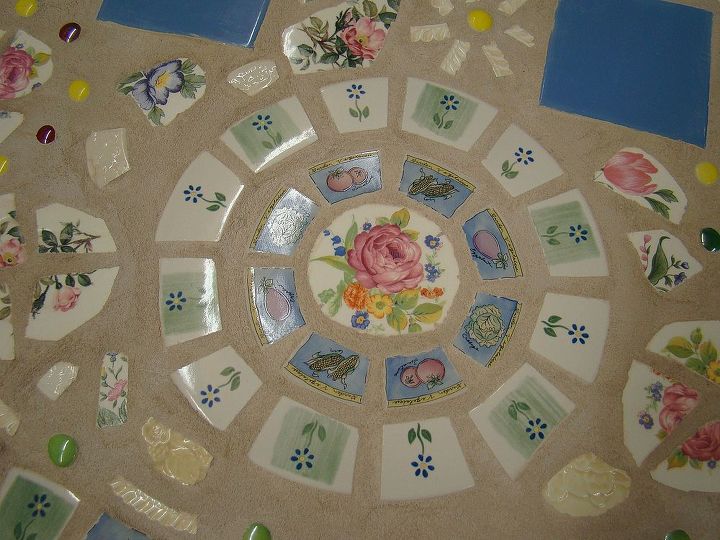 mosaic table for the patio or garden, outdoor furniture, painted furniture, tiling, close up of a plate area I am going to buy clear glass plates to put over this when I serve tea parties