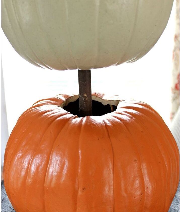 pumpkin topiary fall decorating ideas, container gardening, crafts, gardening, seasonal holiday decor, Start by placing a Styrofoam block in your container Use a dowel to stack your carve able pumpkins You will need to remove two stems off of the two bottom pumpkins