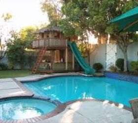 backyard retreats, WOW A playhouse that has a slide down into the pool I am there