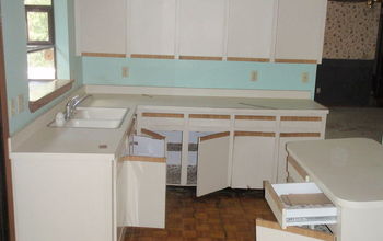 This is a before shot of a kitchen remodel at distressed bank owned home.