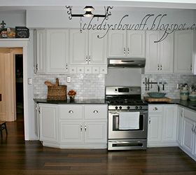 we re in the process of transforming our kitchen on a budget to fit our style we, home improvement, kitchen backsplash, kitchen design, kitchen island, Cabinets are painted with Benjamin Moore s Satin Impervo color is Moonshine actually gray not white We love the durable finish and that the grain still shows through