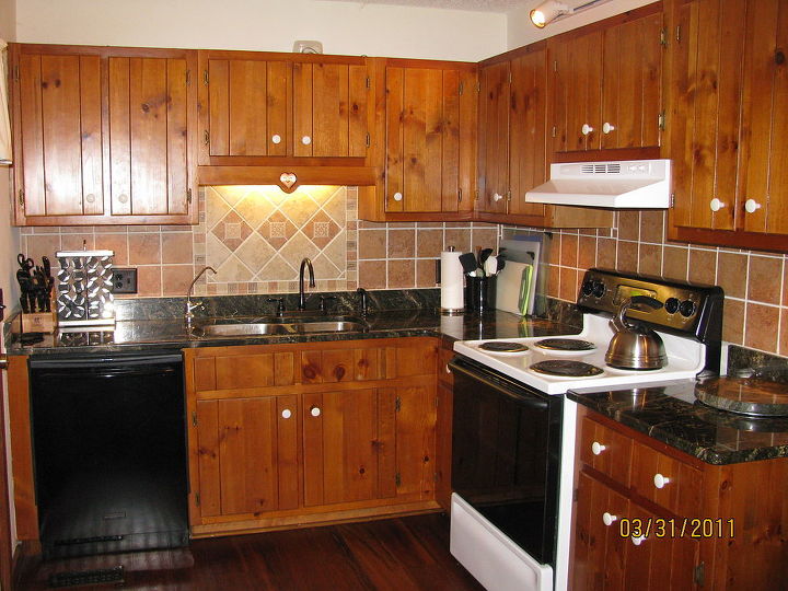 kitchen after remodelling granite countertops and tile backsplash and new lighting, countertops, home improvement, kitchen backsplash, kitchen design, tiling, kitchen after remodelling granite countertops and tile backsplash and new lighting