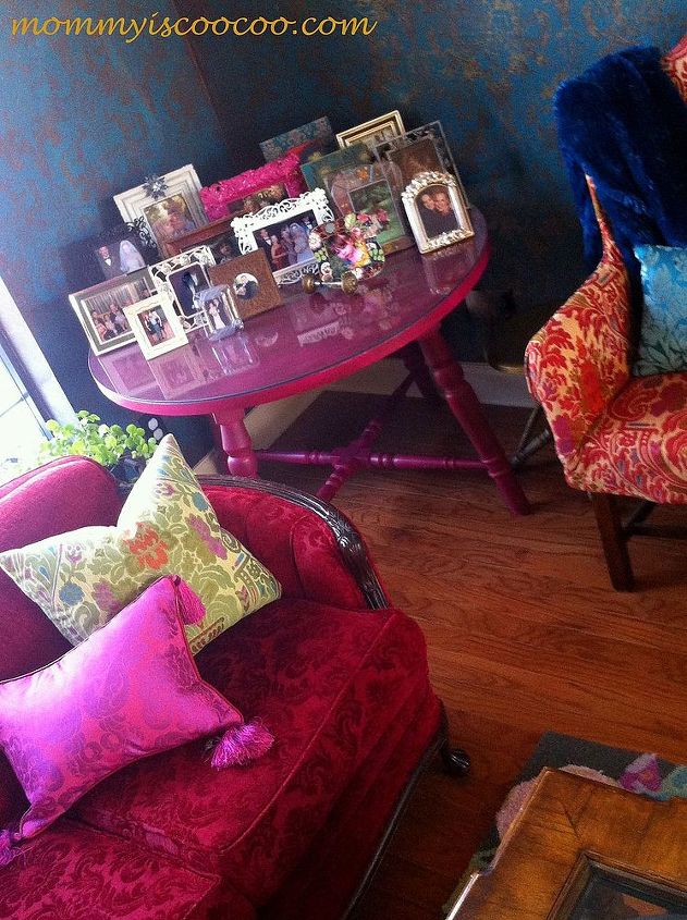 creating eclectic which is kind of coocoo style tips and ideas, home decor, I love a table full of pictures This antique table painted hot pink is perfect for the corner