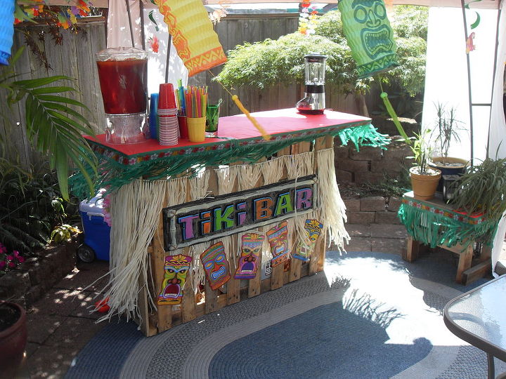 building a tiki bar from pallets, pallet, After decorations lookin good