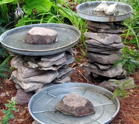 stacked stone bird baths, outdoor living, repurposing upcycling, Stone leftover from another project and three galvanized trash can lids become a bird bath grouping Another of my use what you have ventures More pictures and directions at