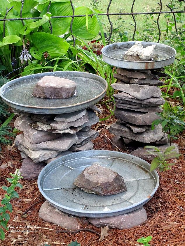 stacked stone bird baths, outdoor living, repurposing upcycling, Stone leftover from another project and three galvanized trash can lids become a bird bath grouping Another of my use what you have ventures More pictures and directions at