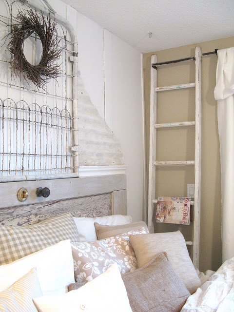 24 wow ideas from just a ladder, repurposing upcycling, A ladder beside a bed makes a fabulous magazine rack