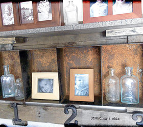 a rusty bin and pallet wood shelf, diy, how to, living room ideas, pallet, shelving ideas, woodworking projects, The metal bin is a shelf itself perfect for holding smaller photos and items like these vintage glass bottles
