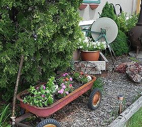 my gardentour, gardening, outdoor living, wagons and stone cutter are wonderful rustic accents