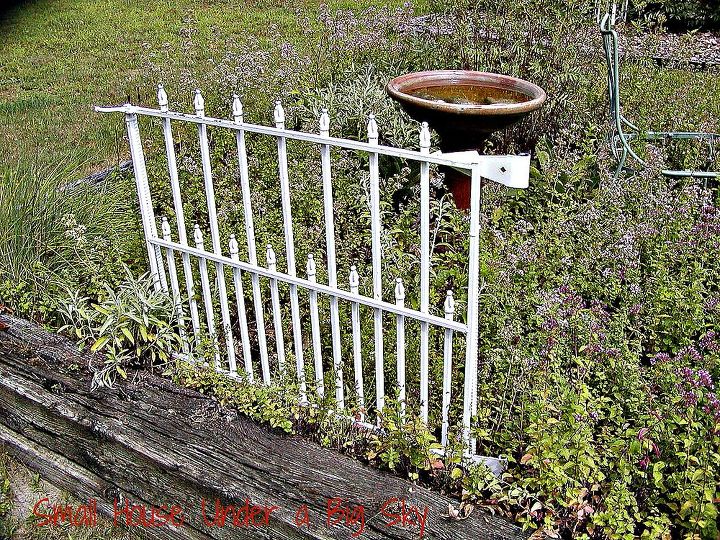 metal dog gate repurposed into decorative garden accent, fences, gardening, repurposing upcycling, Another view of the gate