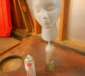 diy garden head project, Betty also got several coats of Metallic Stone paint It was easy to paint her while she was sitting on the bottle I liked her on the bottle so much I decided to keep her there