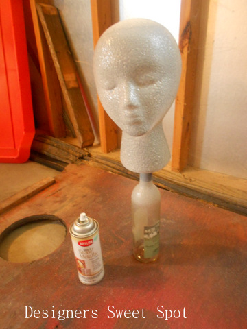 diy garden head project, Betty also got several coats of Metallic Stone paint It was easy to paint her while she was sitting on the bottle I liked her on the bottle so much I decided to keep her there