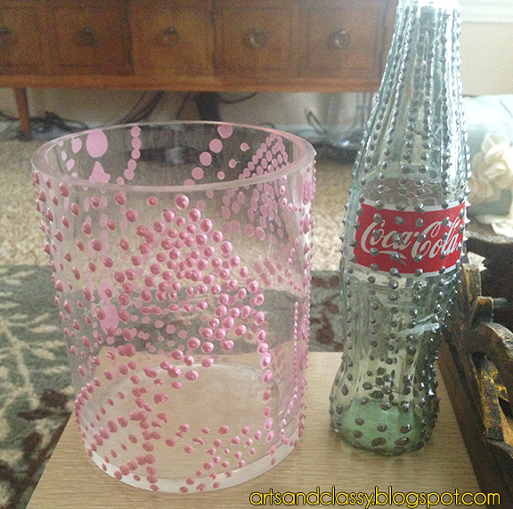 inexpensive easy diy project create porcelain and aged bronze vases, crafts, repurposing upcycling, You will start by peeling off labels form the bottles of cans I didn t peel the coke label off it was really stuck So I painted over it Next you figure out the pattern you want to do and start applying the puffy paint I had