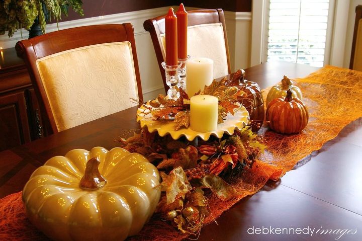 five easy steps to warm amp cozy fall decor, seasonal holiday decor, a ceramic cake pedestal a table runner and some ceramic pumpkins make a centerpiece for everyday it s easy to remove when the whole table is needed for a project
