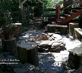 build your own fire pit, outdoor living, patio, Build your own stacked stone fire pit with rustic benches and tables made from logs This project was completed over three days and transformed a weedy slate patio into a family gathering place See my blog at