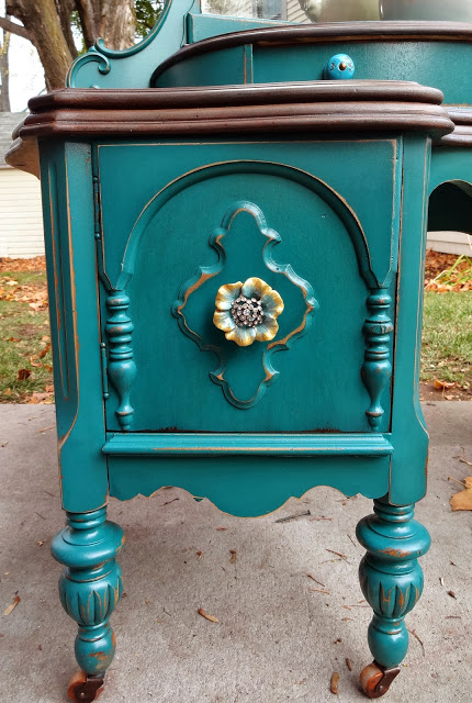 refinished antique vanity in teal, painted furniture, You ve heard it before but knobs and pulls really are the jewelry on your furniture They can totally change the look of a piece These are just perfect for her new look