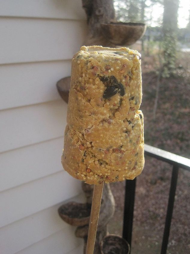 making peanut butter bird treats for my feathered friends, We placed them on the balcony here s one on a bamboo stick