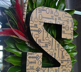 how to make a front door monogram, crafts, decoupage, seasonal holiday decor, The magnolia leaves cattails and feathers add color and interest