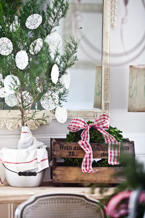 simple natural easy christmas decor, christmas decorations, living room ideas, seasonal holiday decor, wreaths, Christmas tree sapling in a jug with doilie snowflakes