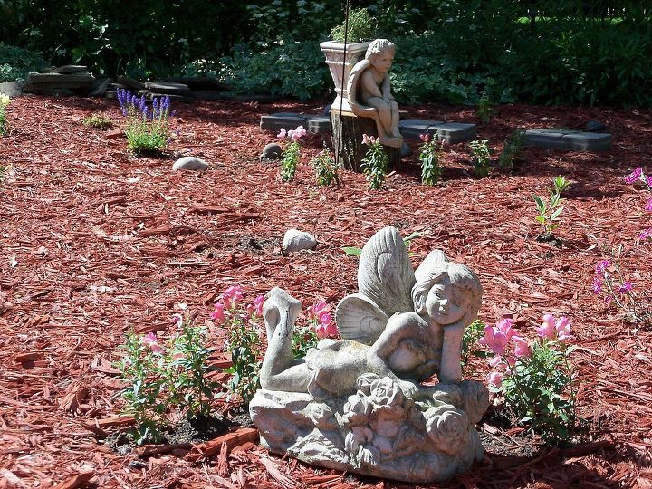 transforming my backyard into a secret garden part 2, flowers, gardening, landscape, perennial, raised garden beds, Put out some of my fairies and angels Planted some snapdragons around them for some color while my perennials are growing in