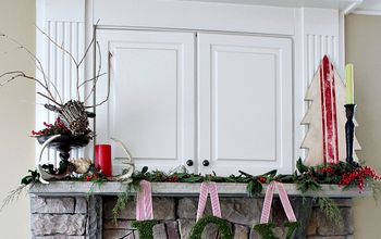 Christmas Mantel Decorated with Antlers, Holly and Cedar