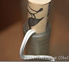upcycle wine bottles into frosted luminaries, crafts, home decor, lighting, repurposing upcycling, Cut a notch in the cork for the cord