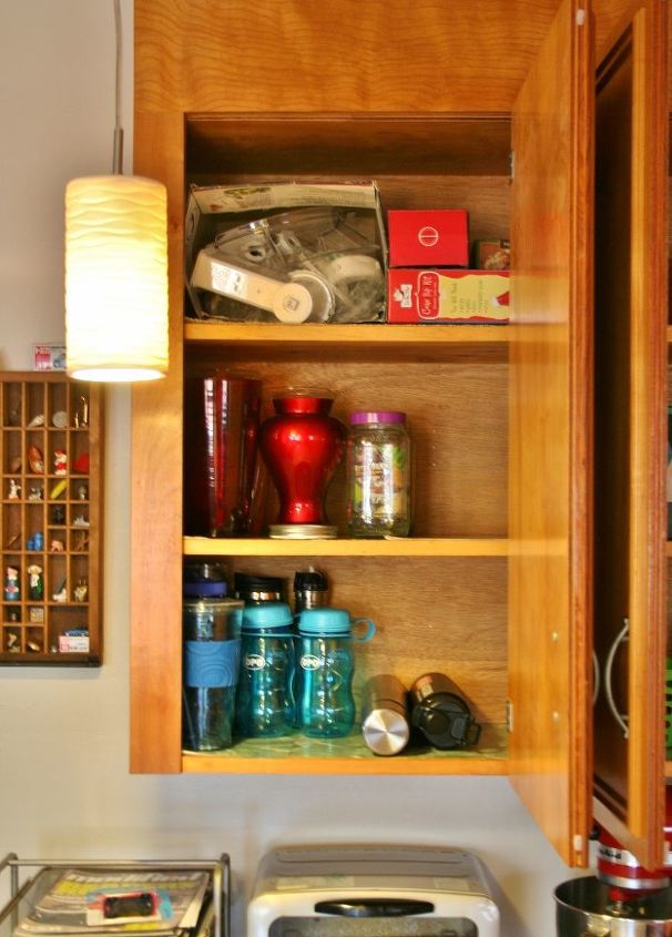 organizing kitchen cabinets with a cork message center, kitchen cabinets, kitchen design, organizing, I pared down as bottles and vases as I could