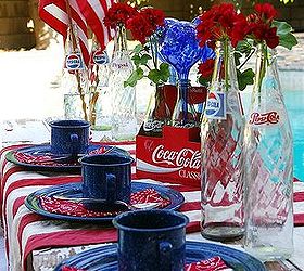 patriotic table decor it s all bottled up, outdoor living, patriotic decor ideas, repurposing upcycling, seasonal holiday decor, It s not always about flowers check out those blue blown glass watering bulbs used in the centerpiece
