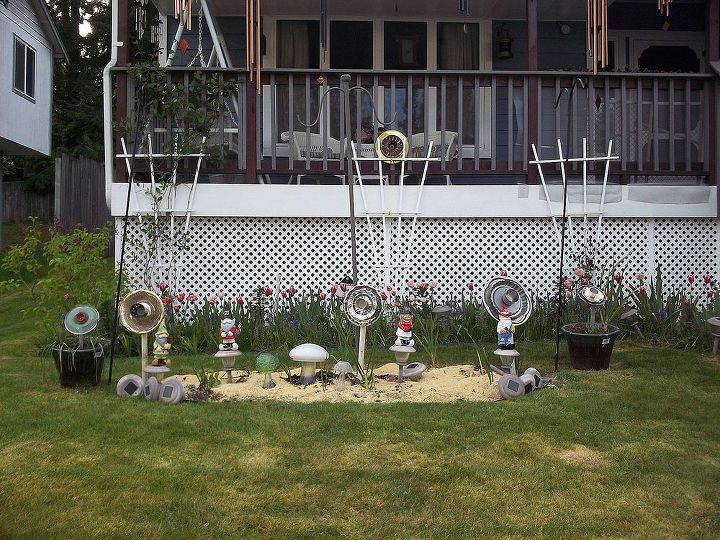 mushrooms flowers and gnomes oh my, flowers, gardening, The whole scene with 4 recycled flowers 3 mushrooms and 4 gnomes 3 of which are Nebraska fans The other one is Army of course