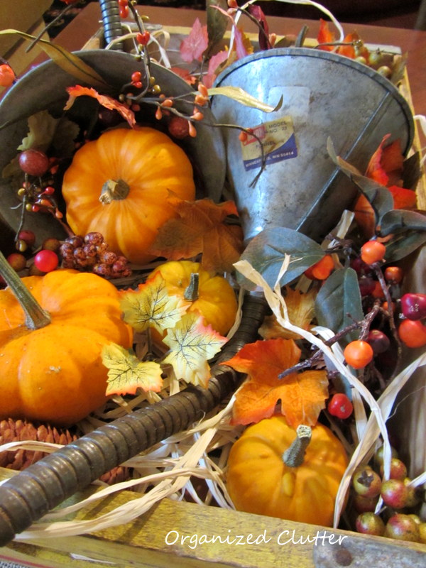 re purposed funnels as fall cornucopia, repurposing upcycling, seasonal holiday decor, Funnels raffia mini pumpkins and gourds faux berries leaves acorns and pinecones fill the crate and the cornucopias