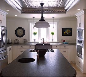 kitchen renovation in 1918 farmhouse, home decor, kitchen backsplash, kitchen design, living room ideas, Some of the details include copper sinks and taps granite countertops with a leather finish and natural tin ceiling Also no upper cabinets backsplash is v groove paneling and countertops are 30 deep on this wall