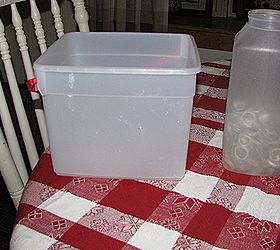 how to make ice luminaries, outdoor living, seasonal holiday decor, Use a square ice creme bucket and a 1 qt container filled with something to weight it down