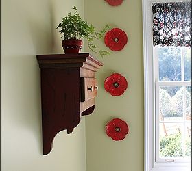 my laundry room got happy, home decor, laundry rooms, shelving ideas, Every room should have a plant This little wall shelf was made by my husband I love the red poppy plates on the green walls They were in my attic