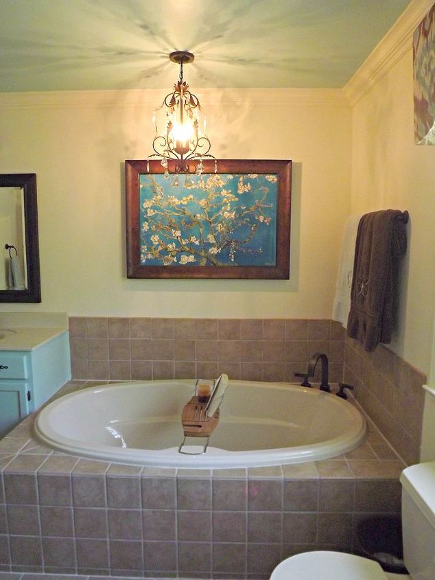 master bathroom makeover, bathroom ideas, home decor, Added a new chandelier over the tub we know it s not to code but it looks so pretty