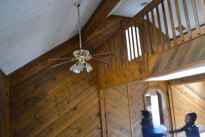 what floors are best with wood walls, This is the door that leads sin to the kitchen The wood yes up into the upstairs loft area Thinking about changing the rails to iron rails