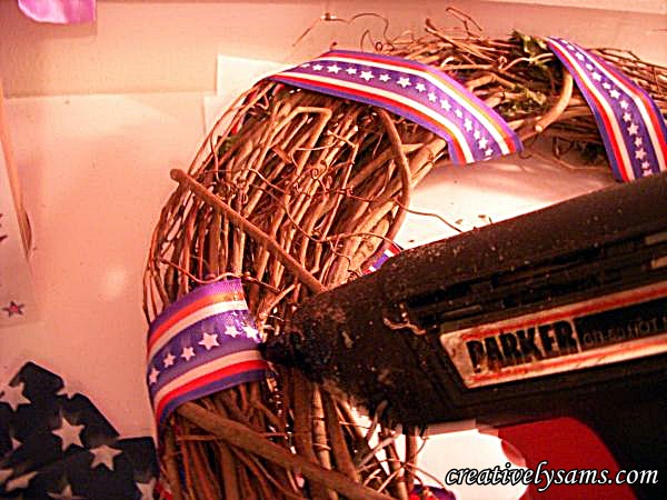 patriotic wreath tutorial, crafts, patriotic decor ideas, seasonal holiday decor, wreaths, Glue on ribbon wind the rest of the ribbon around the wreath