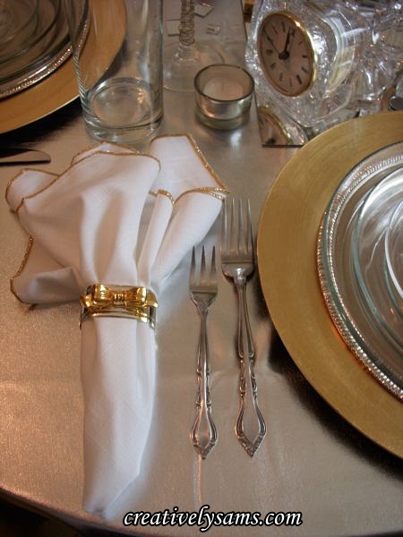new year s tablescape, seasonal holiday decor, I used a white napkin trimmed in gold and silver gold napkin rings I love the way the white of the napkins reflects on the tablecloth