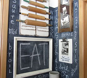 decorating a kitchen with vintage collections, home decor, kitchen design, repurposing upcycling, Chalkboard kitchen wall with cooking verbs kraut cutter photo display and rolling pins mounted on shutters