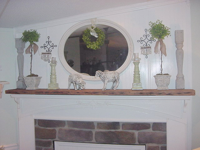 using reclaimed wood to make a rustic mantel, home decor, Here it is attached and decorated