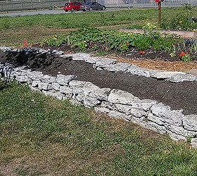 recycling concrete driveways into a beautiful rock garden wall, concrete masonry, flowers, gardening, landscape, perennial, repurposing upcycling, The first side of the bed is built In total 120 of bed was built
