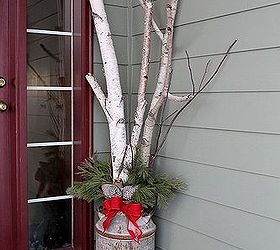 winter floral designs, gardening, porches, Birch branches and white pine tips make a lovely winter display in my old milk jug The bow was made with red burlap ribbon and adds great texture