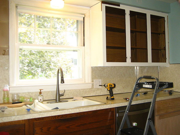removing old laminate backsplash, kitchen backsplash, kitchen design, painting, shelving ideas, Taking down the cabinets