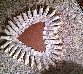 vintage bookpage heart wreath, crafts, repurposing upcycling, seasonal holiday decor, wreaths, Once your first layer of pages is completed start layering more on making your way toward the center