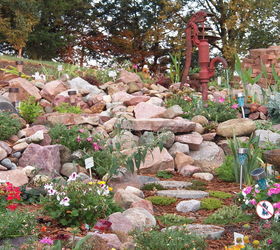 my rock gardens, flowers, landscape, outdoor living, ponds water features, Very old hydrant that runs water into the small pond and then waterfalls down into the larger pond