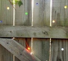 how to create a colorful and family friendly backyard, gardening, outdoor living, Yard fence with marbles