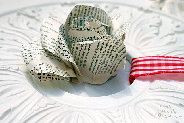 book page rose wreath, crafts, seasonal holiday decor, wreaths, Wrap a few more of the small petal tubes around the first one