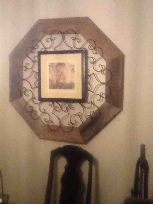 picture frames mirror frames ect, home decor, repurposing upcycling, I purchased the wrought iron had it for years I bought it at Hobby Lobby on sale The barn wood was in a field So it s free The picture was just hung on it I found the picture at a garage sale I needed color to tie it all together in the room