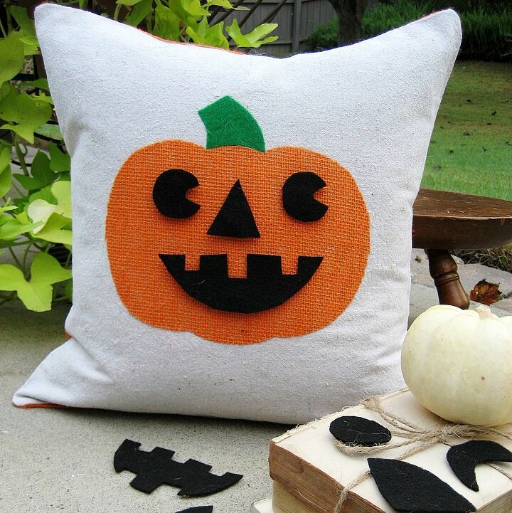 easy and cheap halloween ideas, crafts, halloween decorations, repurposing upcycling, seasonal holiday decor, My favorite a fun Jack o lantern pillow with interchangeable faces A pocket on the back stores the extras Find instructions here